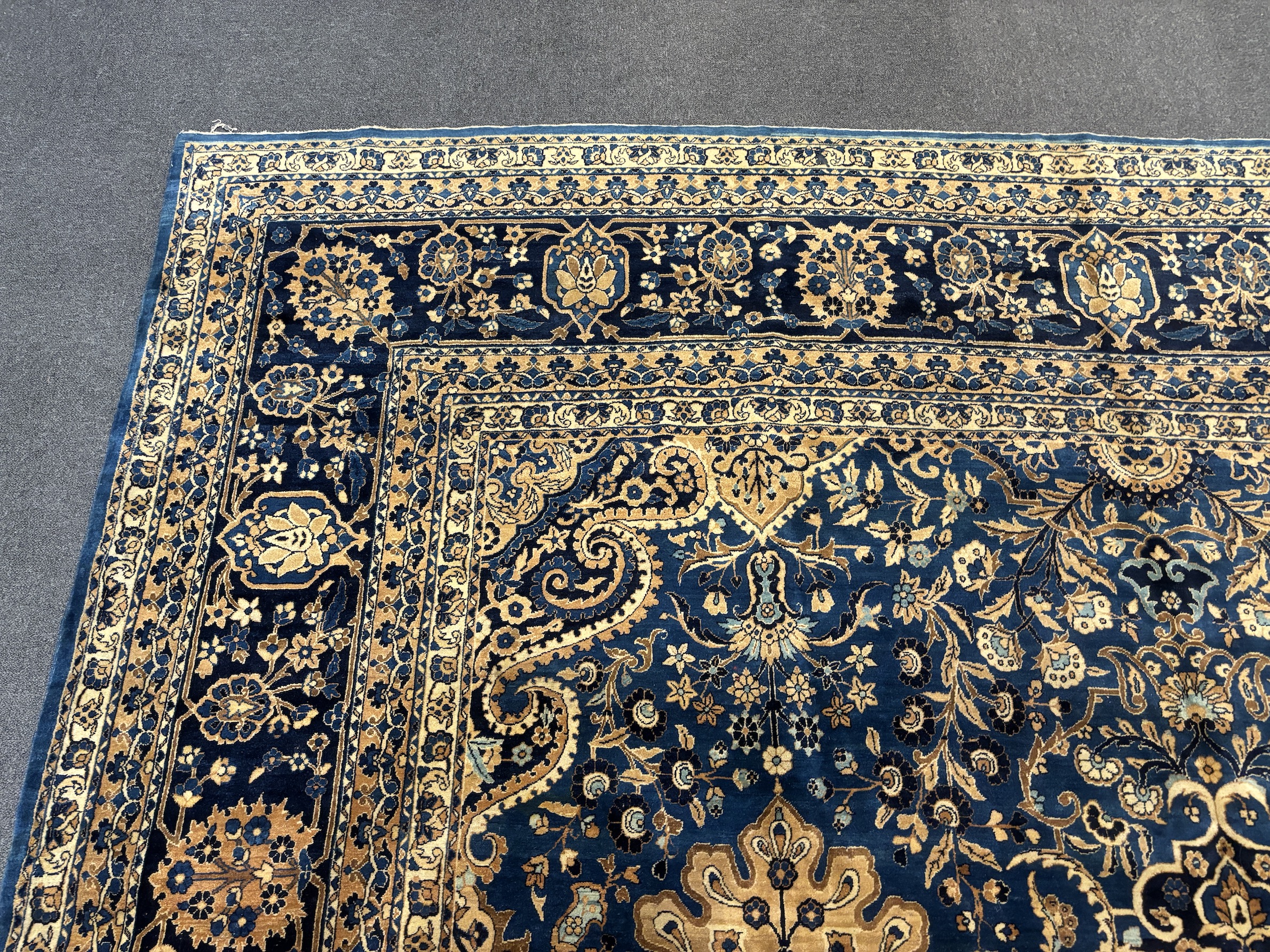 An early 20th century Kirman blue ground carpet, 425 x 325cm